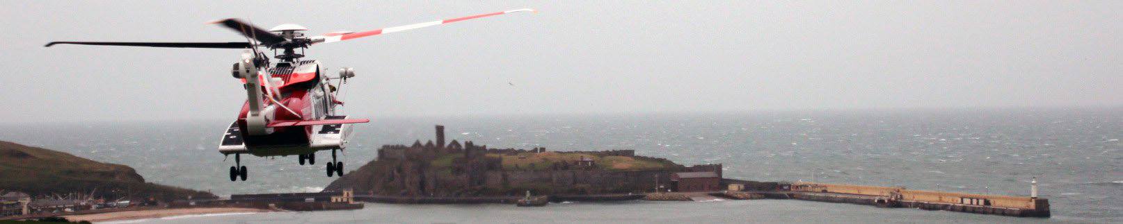 Helicopter and Peel Castle, by Dave Corkish